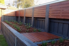 Custom merbau fence extensions and garden bed