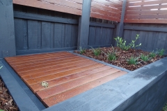 Custom merbau fence extensions and garden bed ft. gardenia and liriopes